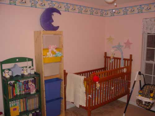 One side of the finished baby room.  That crib is 60 years old!