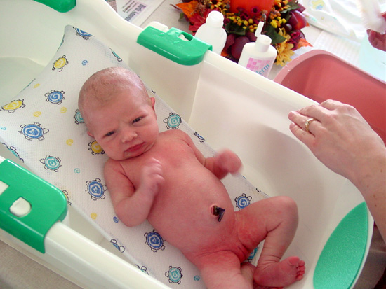 Someday, Emily will enjoy taking a bath.  Probably after she can play and splash mommy.