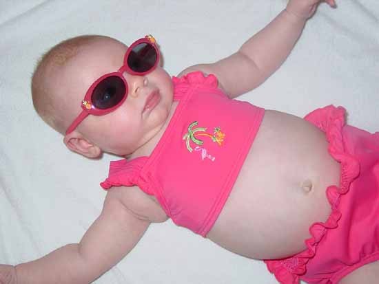 Emily's first swimsuit and first sunglasses.