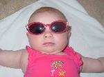 Emily's first swimsuit and first sunglasses.