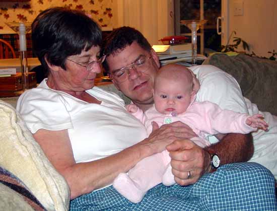 Emily with Grandma Jan and Grandpa Bob.