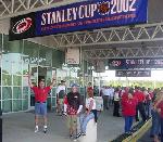 Dave standing under the Stanley Cup Finals banner.