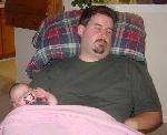 Daddy and Baby sleeping in the chair.