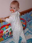 Emily standing in her crib.