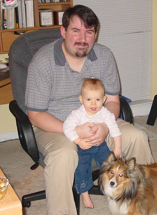 Emily with her daddy and her dog.